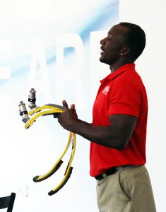 Roderick Sewell shows his running prosthetics and speaks with participants at the 2017 Playmakers Program.
