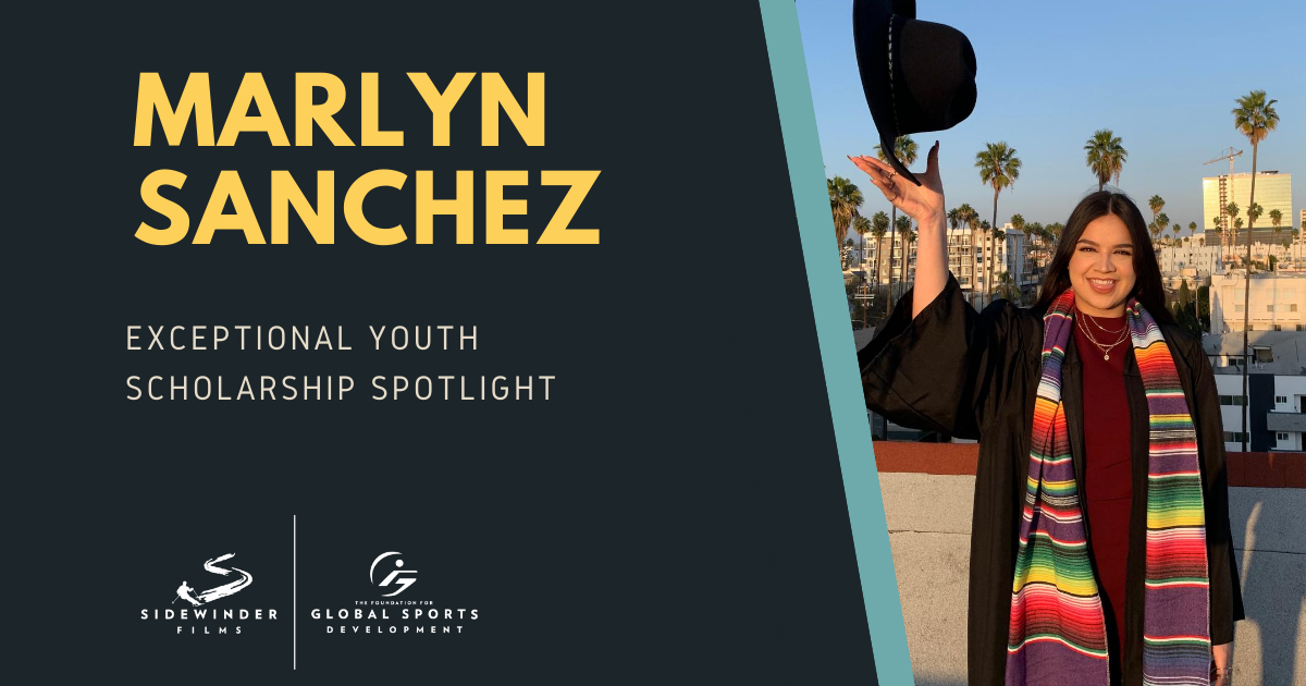 Marlyn Sanchez smiling and tossing up a hat